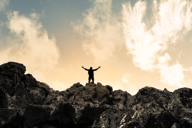 istock Successful male hiker on mountain top. 1619239285