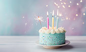 Pastel birthday cake with birthday candles and sparkler