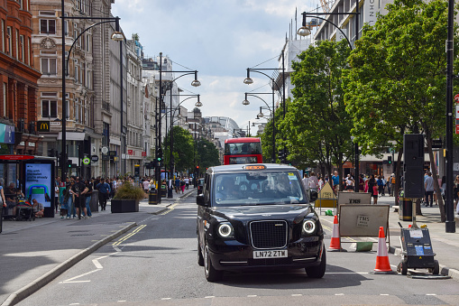 London, UK - August 16 2023: a black cab in Oxford Street.