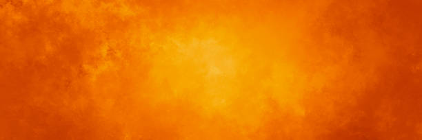 Abstract orange fire background texture, red border with fiery yellow flames and smoke pattern, halloween fall or autumn colors of orange red and yellow.
