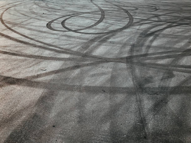 istock asphalt with tire marks, drifting cars, road, patterns, circles, black color 1619282506
