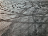 asphalt with tire marks, drifting cars, road, patterns, circles, black color