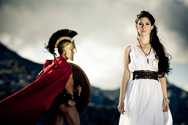 spartan queen Portrait of spartan queen and spartan warrior with selfmade theater clothings,selective focus on her, very creative color retouching to underline the ancient time,vignetting, added noise,some areas with slightly overexposing sparta greece photos stock pictures, royalty-free photos & images