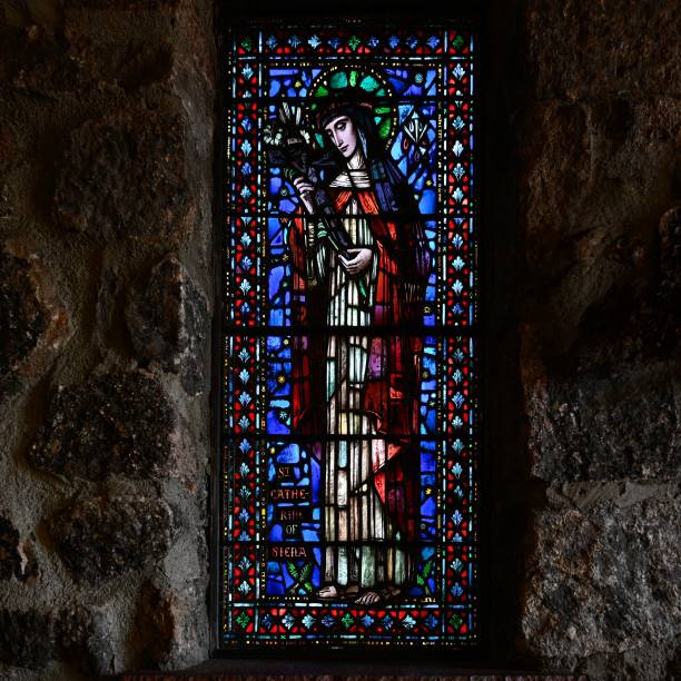 istock a stained glass window showing st john the baptist in a stone wall 1619290613