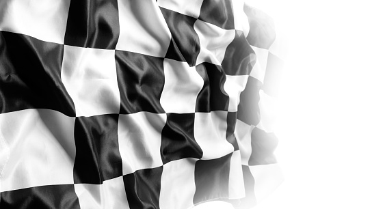 Checkered black and white racing flag on white. Copy space