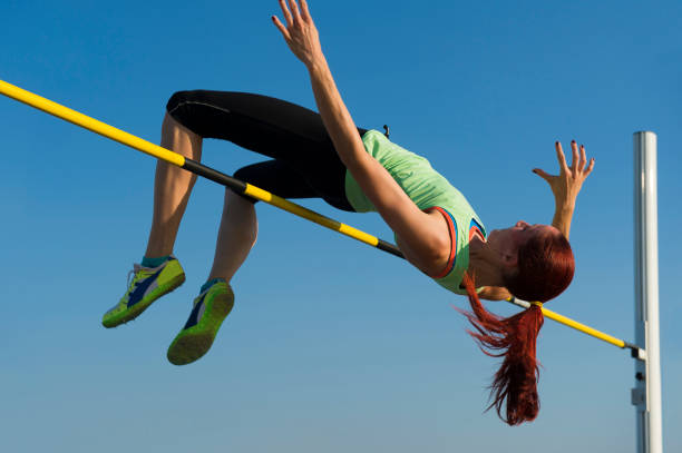 istock Young woman at high jump 161931066