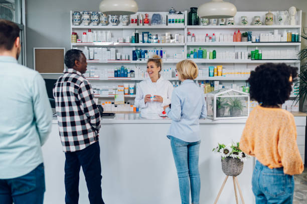 istock A queue of people standing in a pharmacy while shopping for medicine 1619322436