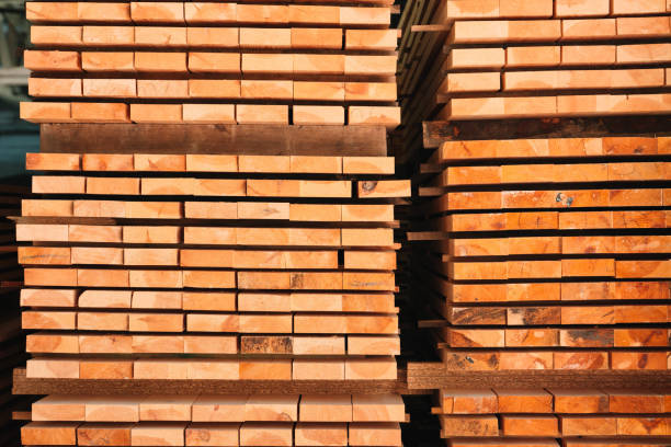 istock Lumber in a large warehouse. Wooden boards in the stack 1619333499