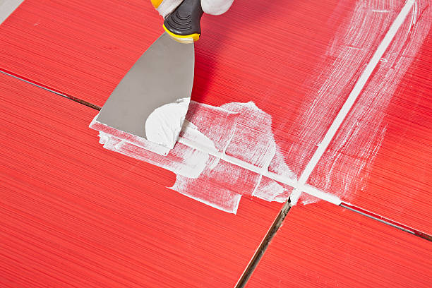 istock steel pallet fill up joints between ceramic tiles whit grout 161935138