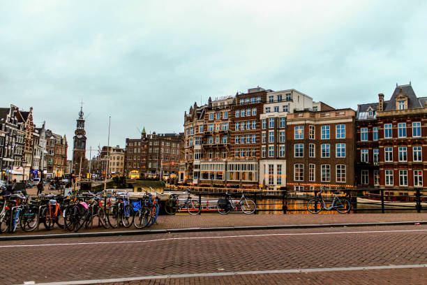 In this captivating photograph, the multifaceted spirit of Amsterdam reveals itself as a dynamic Dutch metropolis that harmonizes tradition with modernity. \