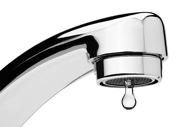 Dripping water tap Water tap with drop, isolated on the white background, clipping path included. faucet photos stock pictures, royalty-free photos & images