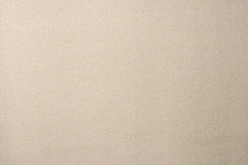 Overhead shot of flat sand texture background.