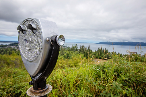 Public binoculars available at a viewpoint in Astoria, Oregon.