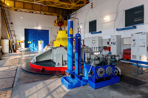 Turbine generators in hydroelectric power plant.