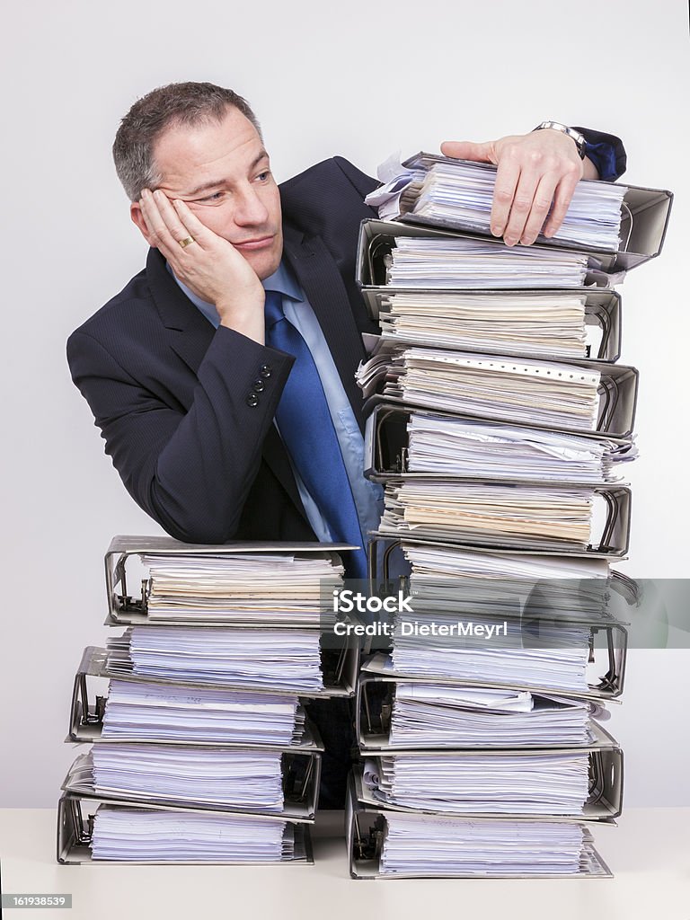 To much  work for one III businessmen with office files Document Stock Photo