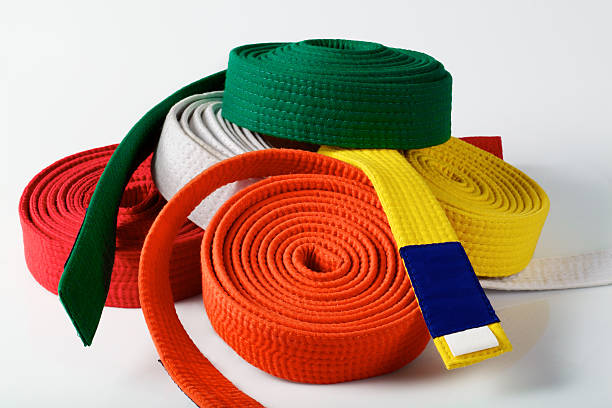Coloured karate belts stock photo