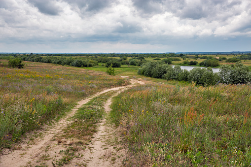 Dramatic rainy sky landscape with Dragatske lake close to Sarny, Rivne region, Ukraine., Western Ukraine.