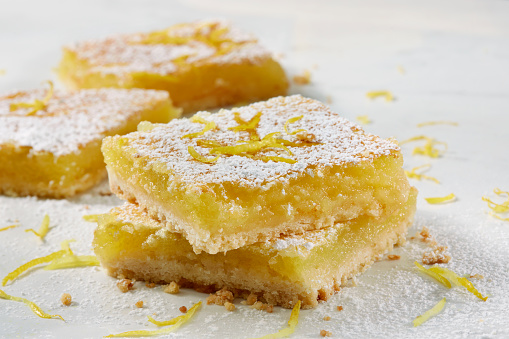 Lemon Dessert Squares with Powdered Sugar and Lemon Zest