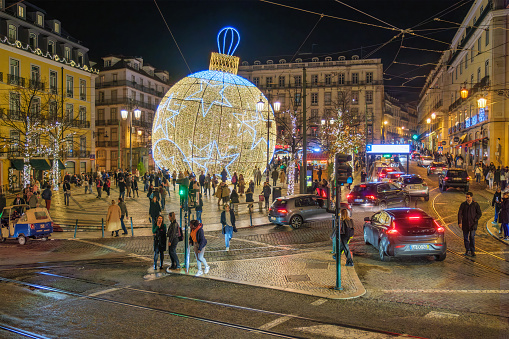 Lisbon, Portugal - December 9, 2022: Christmas decorations on decorated Luis De Camoes square (Praca Luis de Camoes), one of the biggest squares in Lisbon city in Portugal in the evening