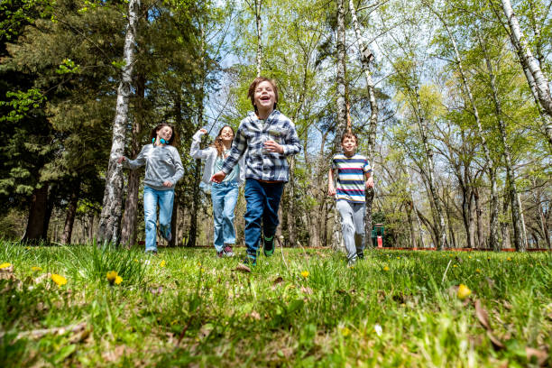 istock children run together in the forest 1619428352