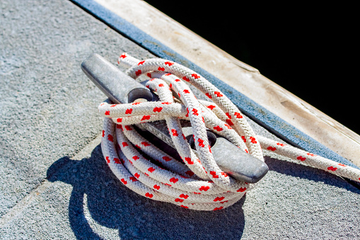Cleat and rope, background with copy space, horizontal composition