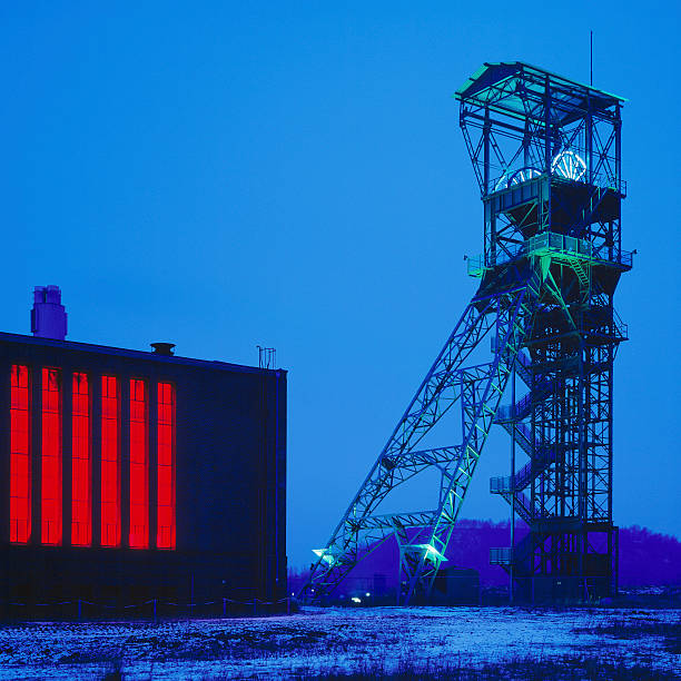 Shaft Tower Of A Coal Mine, Förderturm Illuminated shaft tower of a coal Mine in Alsdorf, Germany alsdorf stock pictures, royalty-free photos & images