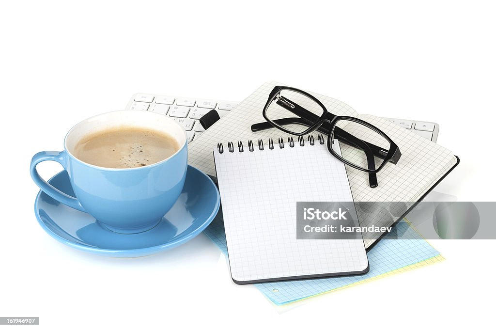 Blue coffee cup, glasses and office supplies Blue coffee cup, glasses and office supplies. Isolated on white background Computer Keyboard Stock Photo