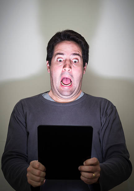 istock Man screams in fear at a tablet device 161951541