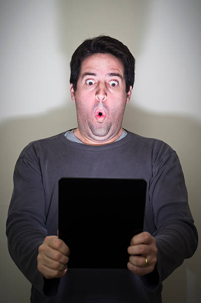 istock Man is amazed by a digital tablet 161951553