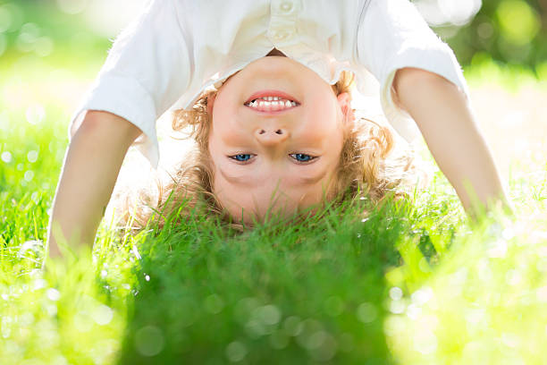 istock A child in the grass having fun 161952232