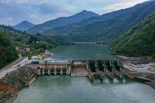 Dam of Kirnati Hydroelectric power plant on Chorokh river, Georgia, aerial drone view.