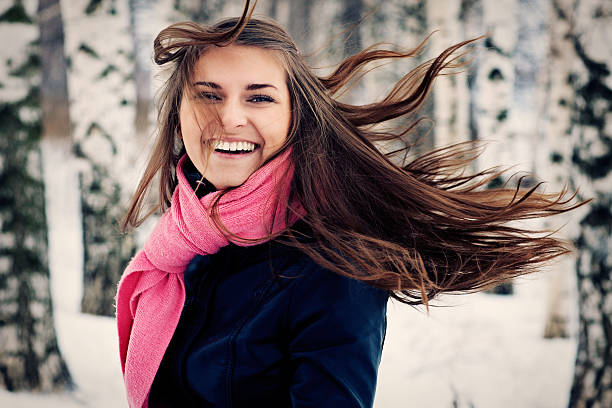 Beautiful young girl happy. Her hair fluttering stock photo