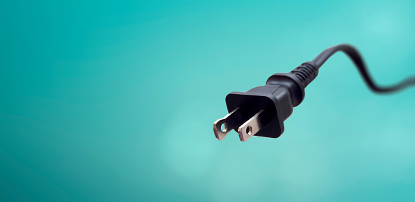 American power cord on a blue background - electricity care concept