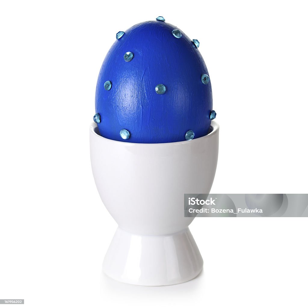 Easter Egg Easter egg on stand on white background. Blue eggshell hand decorated Blue Stock Photo