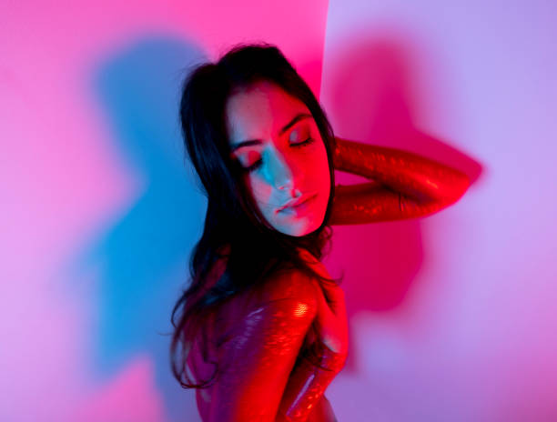 istock Female dancer in red catsuit 1619598591