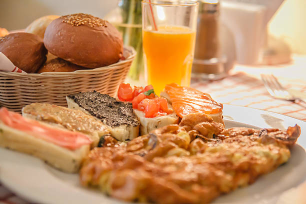 istock Breakfast with juice, omelette, sandwich, jamon and salmon 161960081
