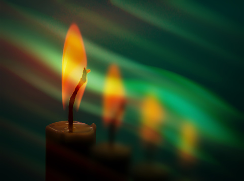 abstract background with soft green color stripes and burning candles. rainbow color effect with copy space suitable for your design