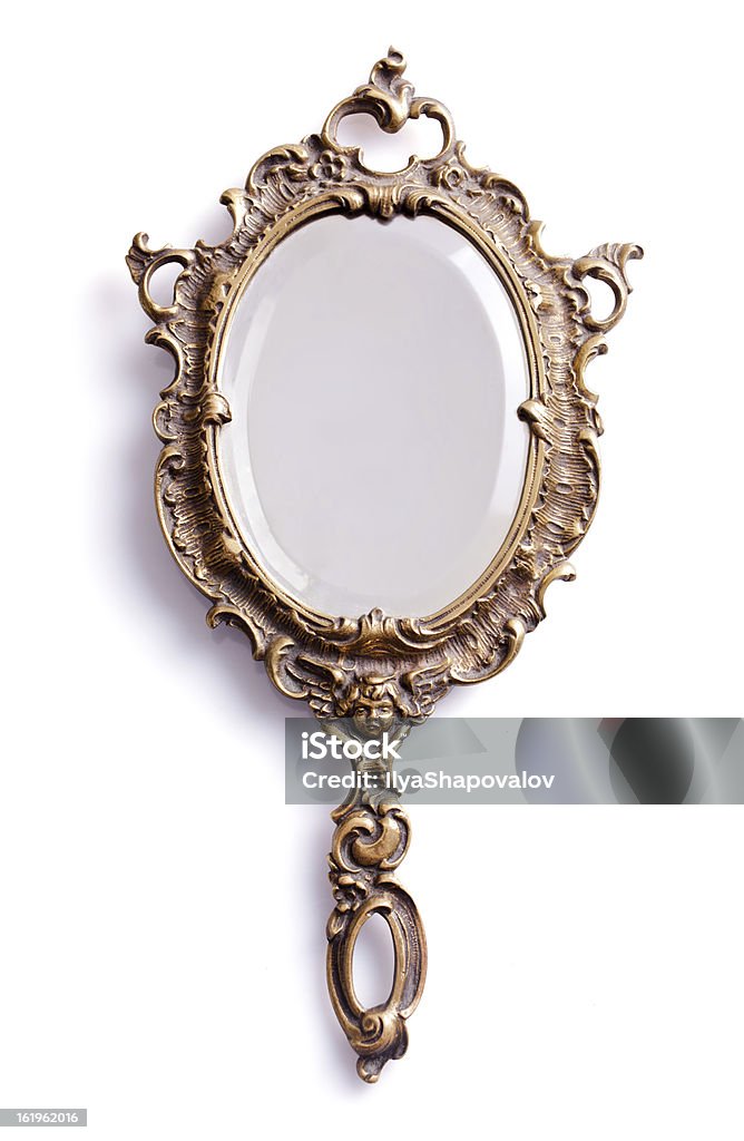 Mirror with golden handle and frame Beautiful vintage isolated hand mirror. Mirror - Object Stock Photo