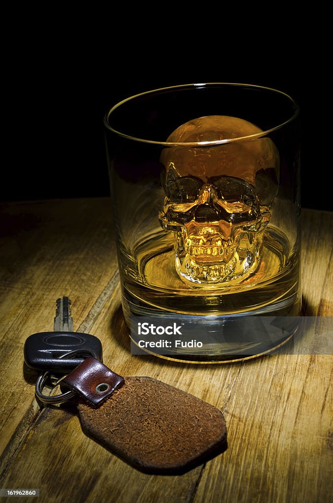 Don't Drink and Drive A glass of whiskey with ice skull and car keys. Alcohol - Drink Stock Photo