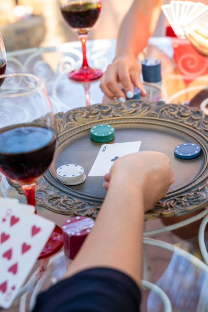 istock Best friends playing cards and having fun together 1619645957
