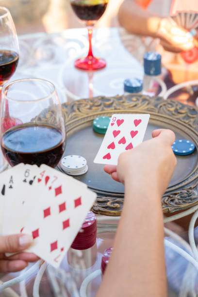 istock Best friends playing cards and having fun together 1619645971