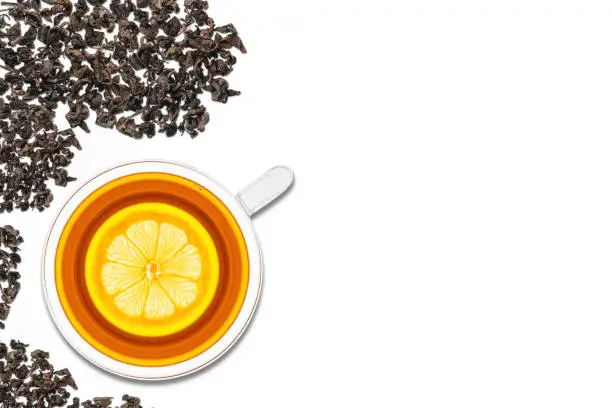 A cup of tea with lemon on a white background. View from above.
Black tea is a type of tea that is more oxidized than oolong, green, and white teas.