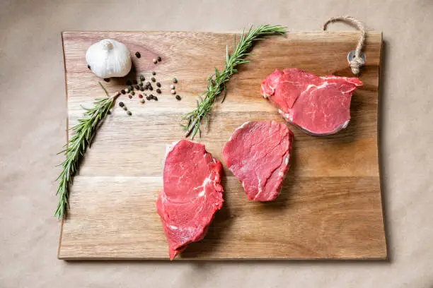 Fresh beef steak on a concrete background