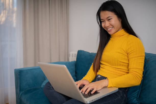 istock Young fashionable woman working at home 1619708977