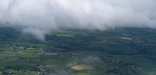 Landscape cork county from air plane window. Ireland green fields from above. Iriish farmlands