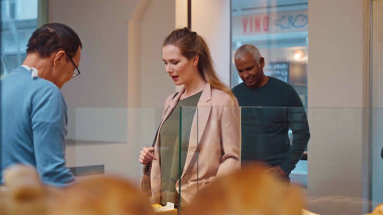 Caucasian Female Ordering Bread at a Cozy Bakery