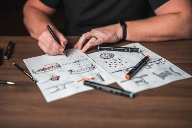 istock Caucasian Male Draws A Storyboard 1619735145