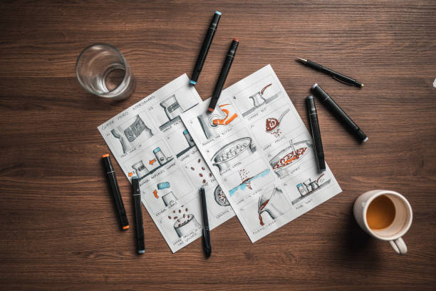 Storyboard Editors Table; Coffee, Colored Pencils And A Smartphone Elevated view on a storyboard editors table. Coffee, colored pencils and a smartphone on the table. storyboard template stock pictures, royalty-free photos & images