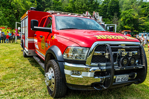 Woodbridge, Canada - July 1, 2023: People are celebrating Canada Day in Boyd Conservation Park, a Vaughan Fire and Rescue Vehicle parking in the park for tourists to watch,Woodbridge, Ontario, Canada.