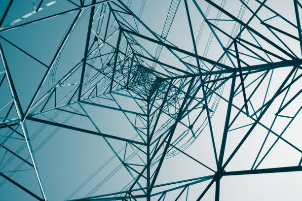 istock Abstract pattern from bottom view of high voltage pole power electricity transmission tower post. 1619959323